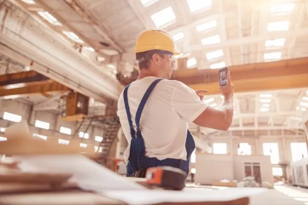 Worker taking a photograph.